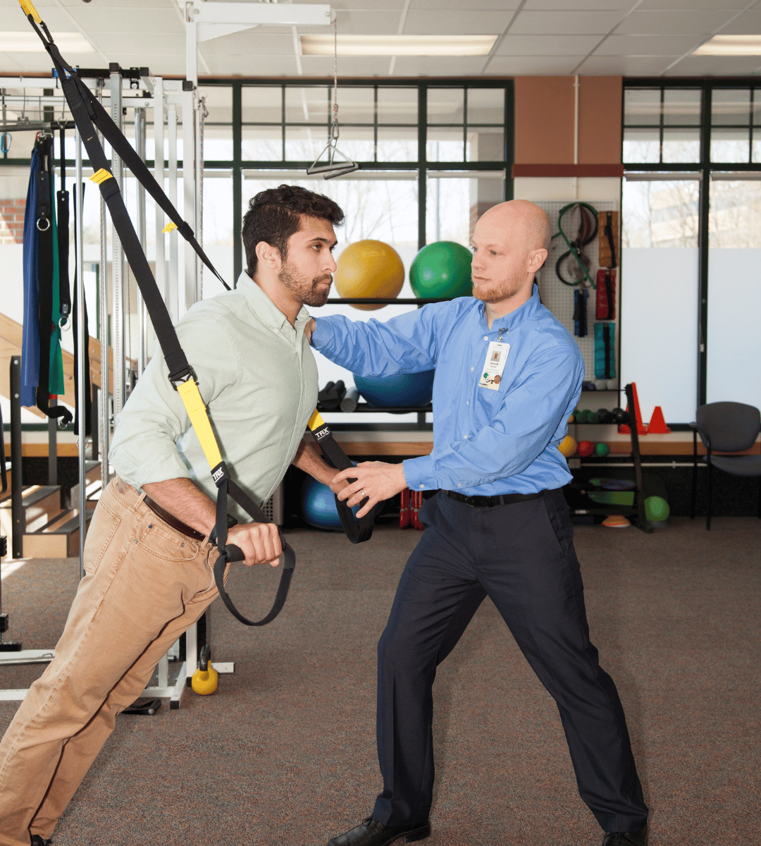 Physical Therapist and patient in gym-like clinic